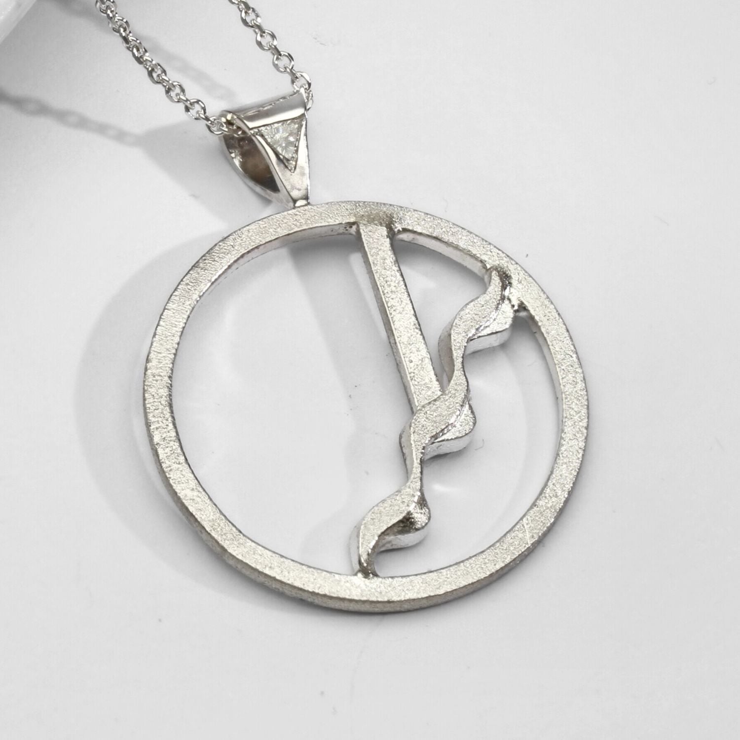 One of a Kind: (No. 14) Bespoke Silver Glissando pendant with Triangular Diamond