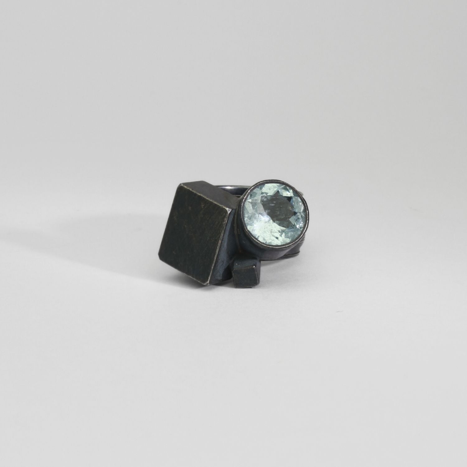 Round aquamarine black silver ring by Chris Boland
