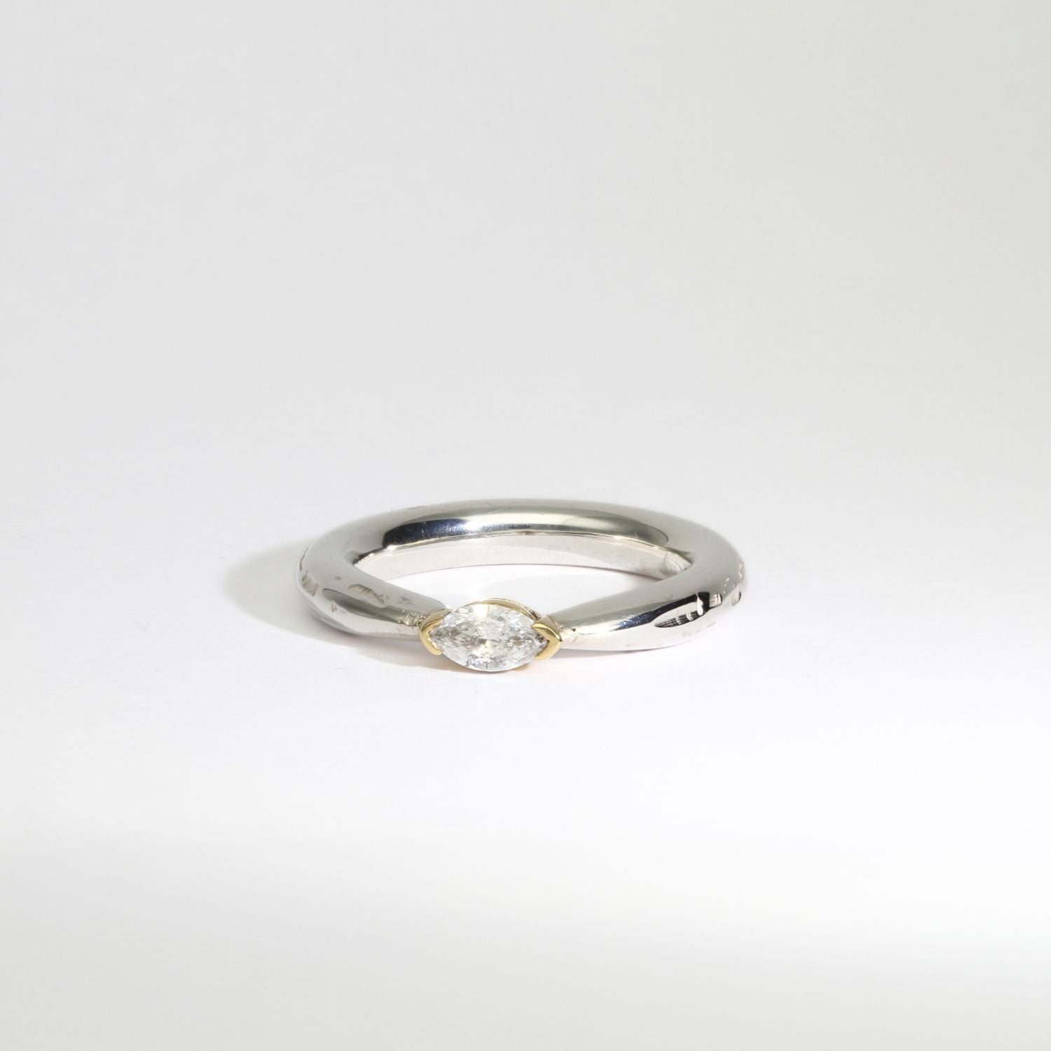 Halo silver ring with a marquise diamond in a 18ct setting by Charmian Ottaway
