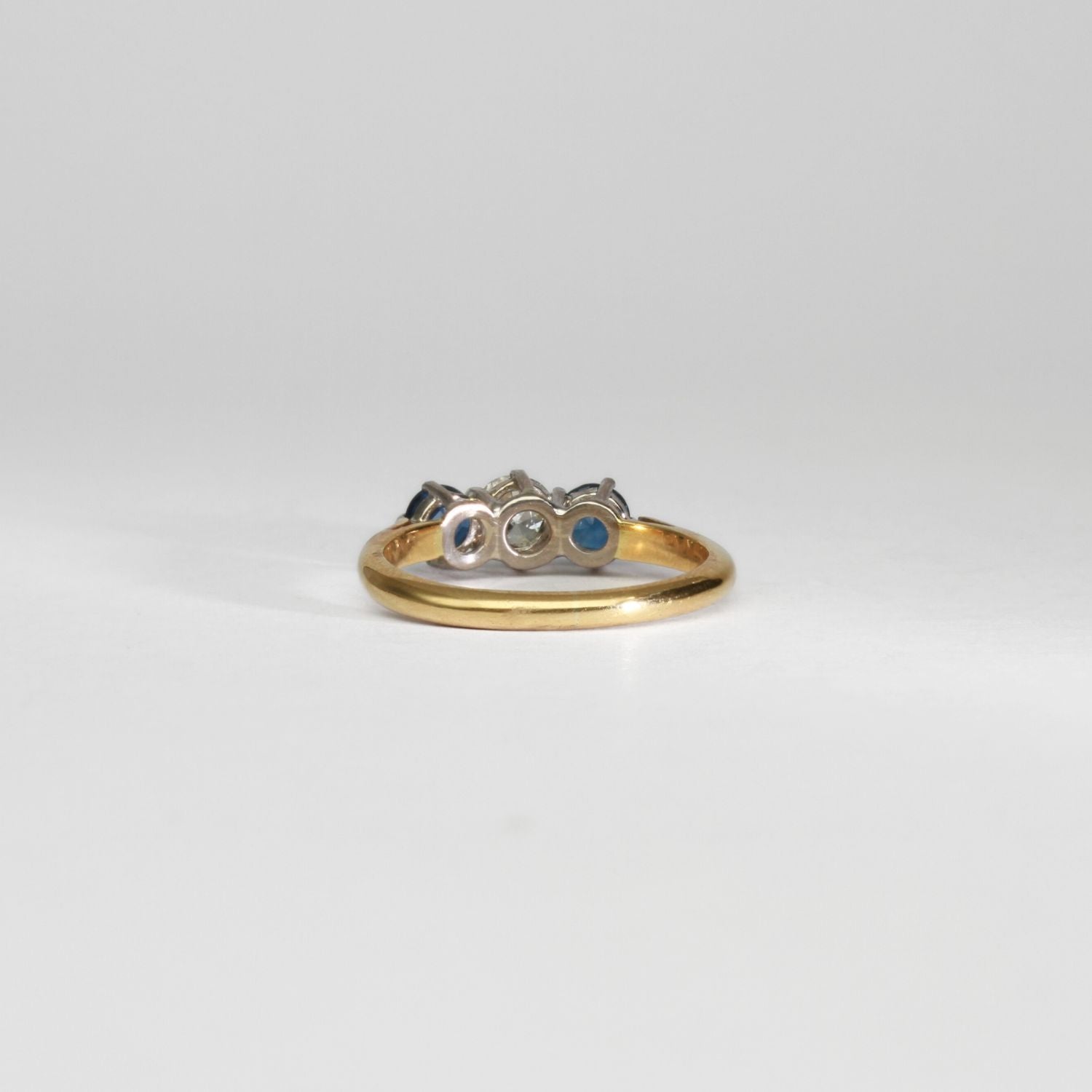 18ct gold ring with blue sapphires and diamond by Duncan Eves