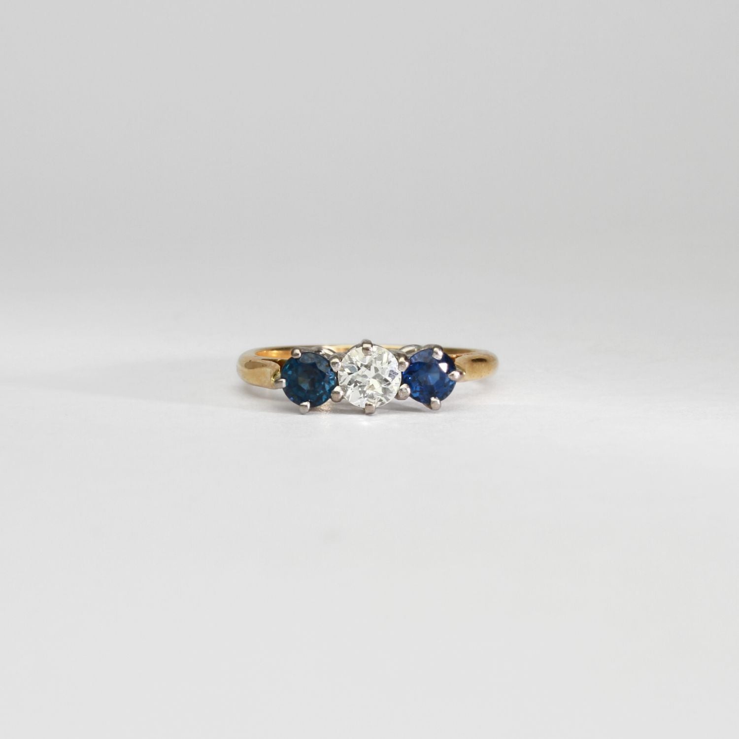 18ct gold ring with blue sapphires and diamond by Duncan Eves