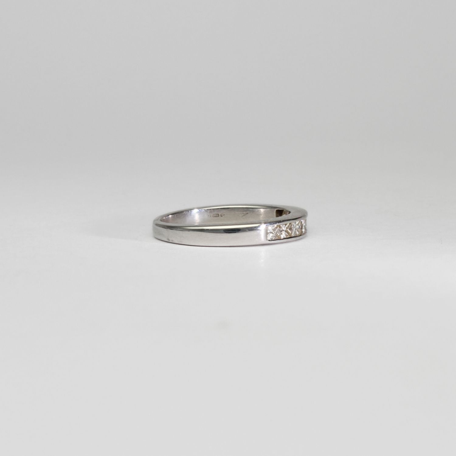18ct white gold ring with 8 princess cut diamonds by Duncan Eves