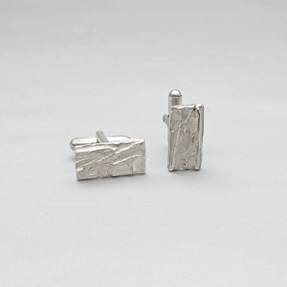 Contemporary Welsh silver jewellery. Inspired by the beautiful landscape of Wales. These textured rectangular cufflinks in frosted and polished silver are designed and handmade in Wales