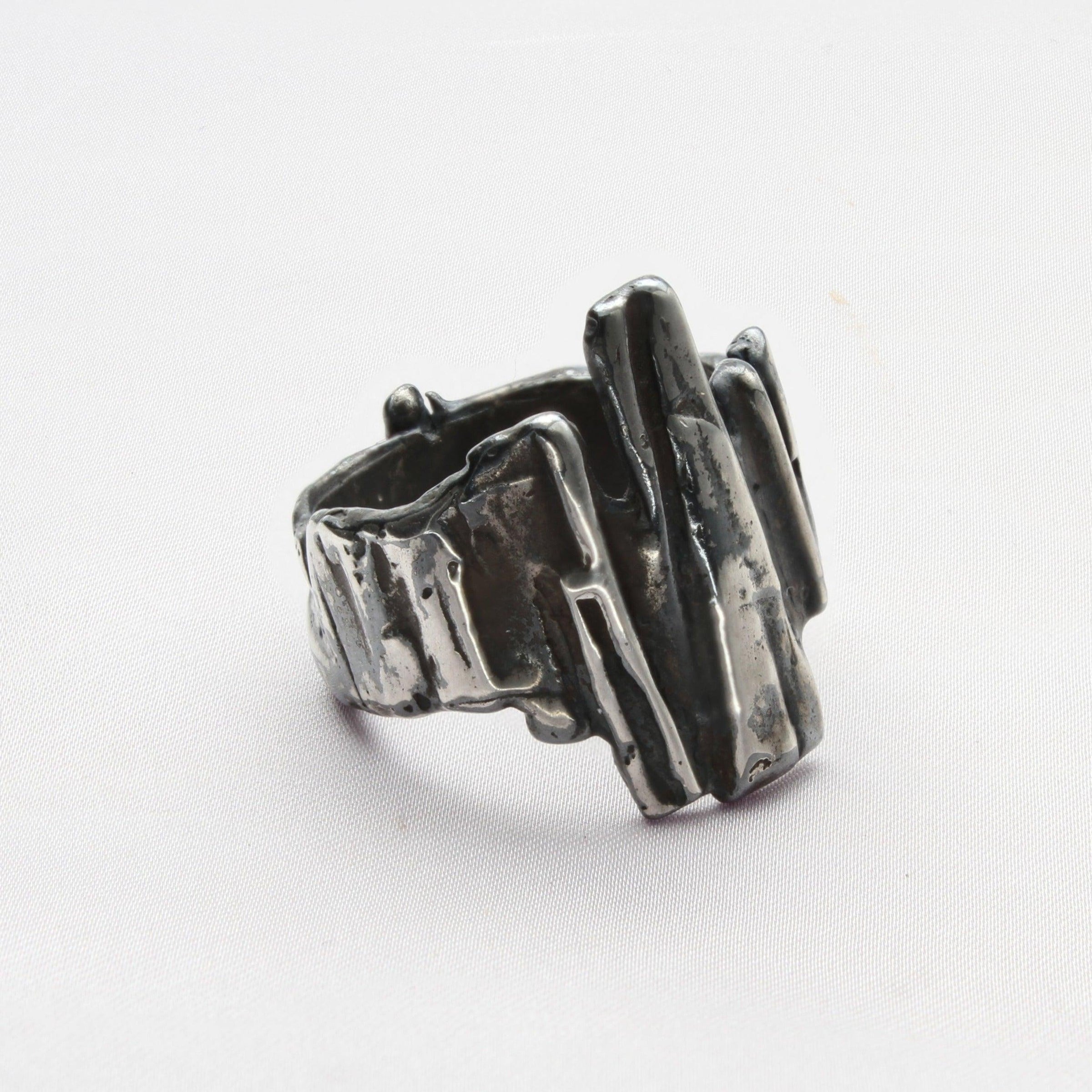 Contemporary Welsh silver jewellery. Inspired by the beautiful landscape of Wales especially slate and anthracite coal. This sculptured ring is designed and handmade in Wales.