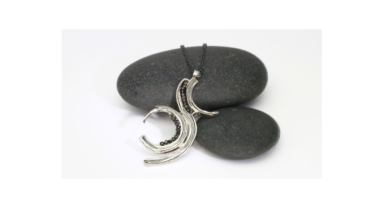 Black diamond and silver pendant inspired by brushstrokes on paper