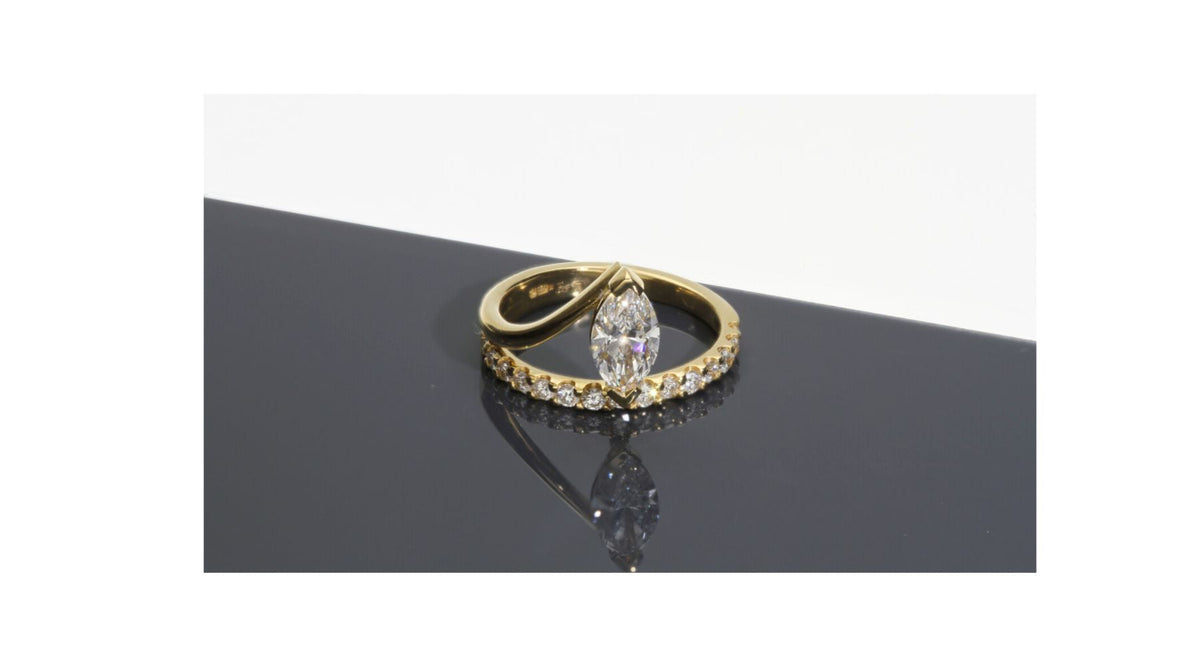 marquise and brilliant cut bespoke engagement ring in 18ct yellow gold