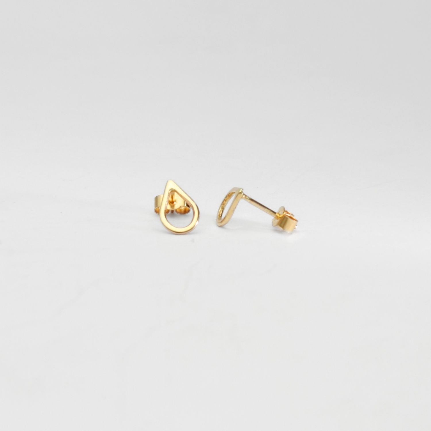 9ct gold tiny raindrop studs by Kate Wimbush