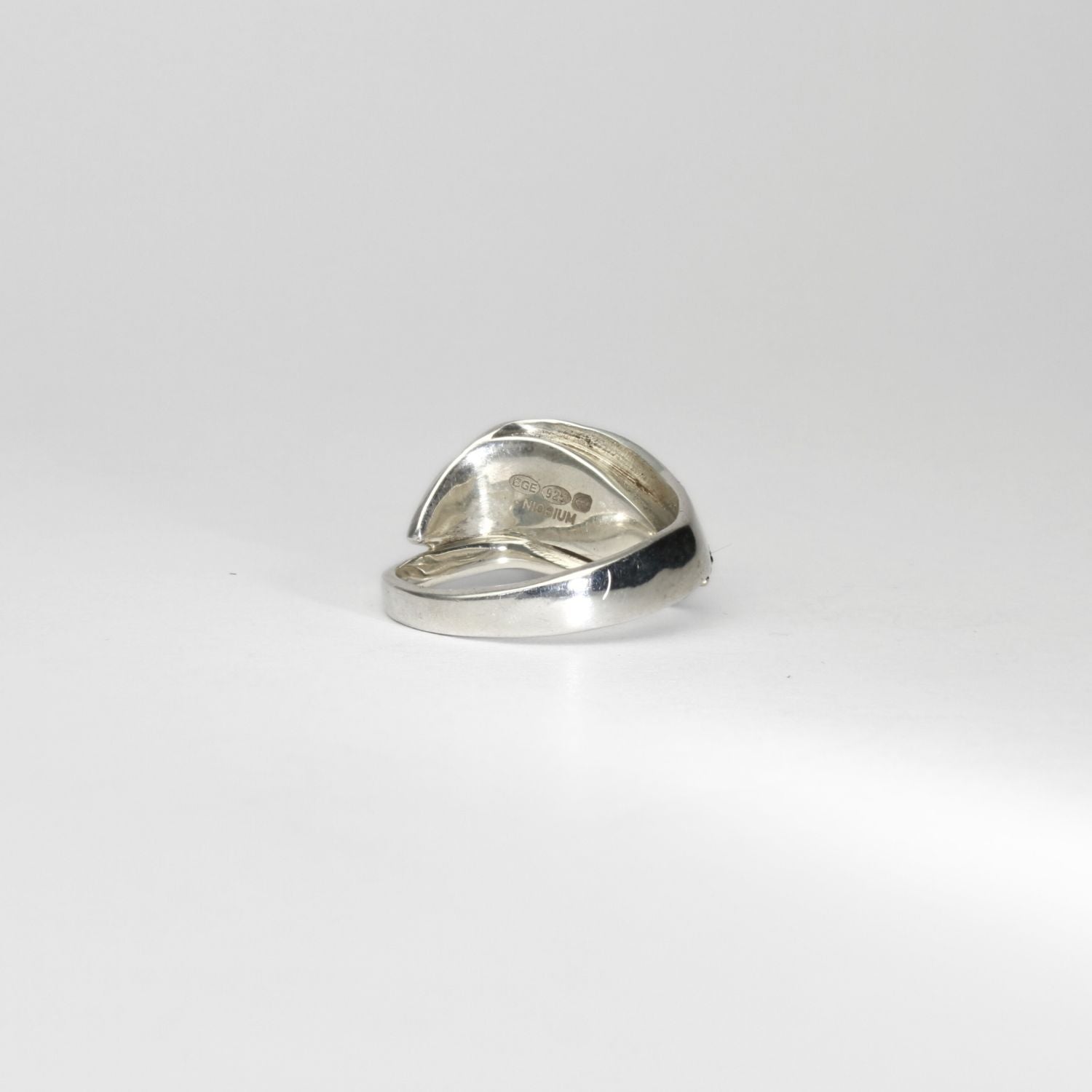 Niobium, silver & gold ring by Brian Eburah