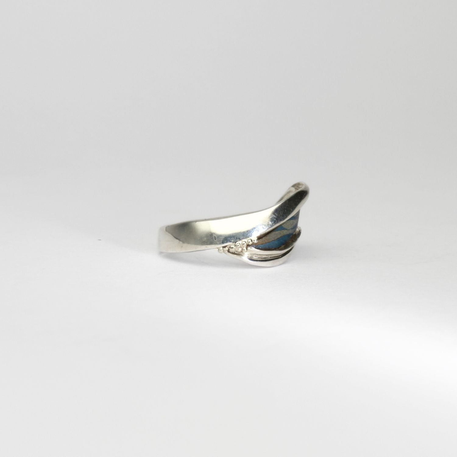 Niobium, silver & gold ring by Brian Eburah