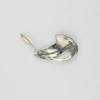 Brooch - titanium, silver & 18ct gold with blue topaz brooch by Brian Eburah