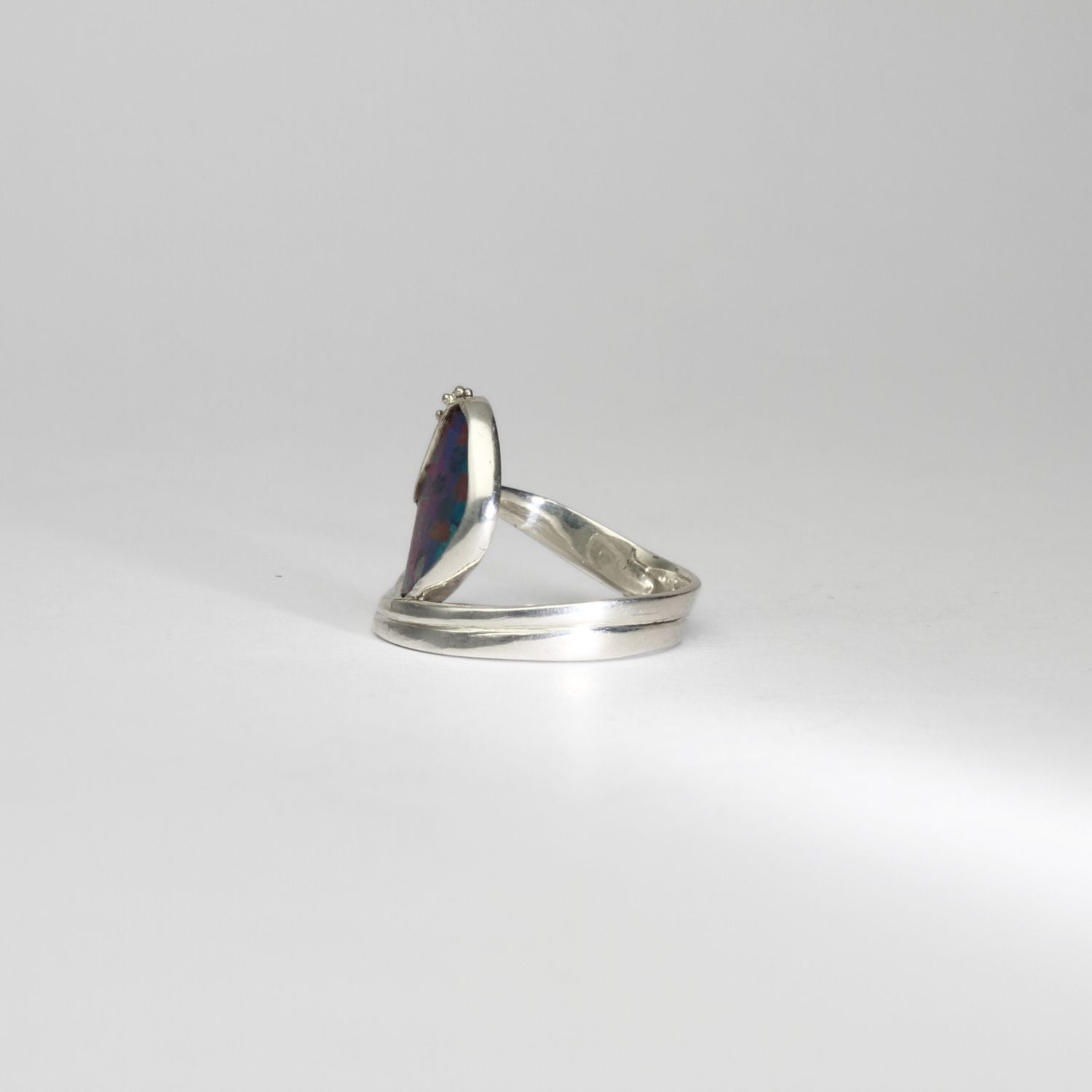 Niobium, silver & gold ring by Brian Eburah