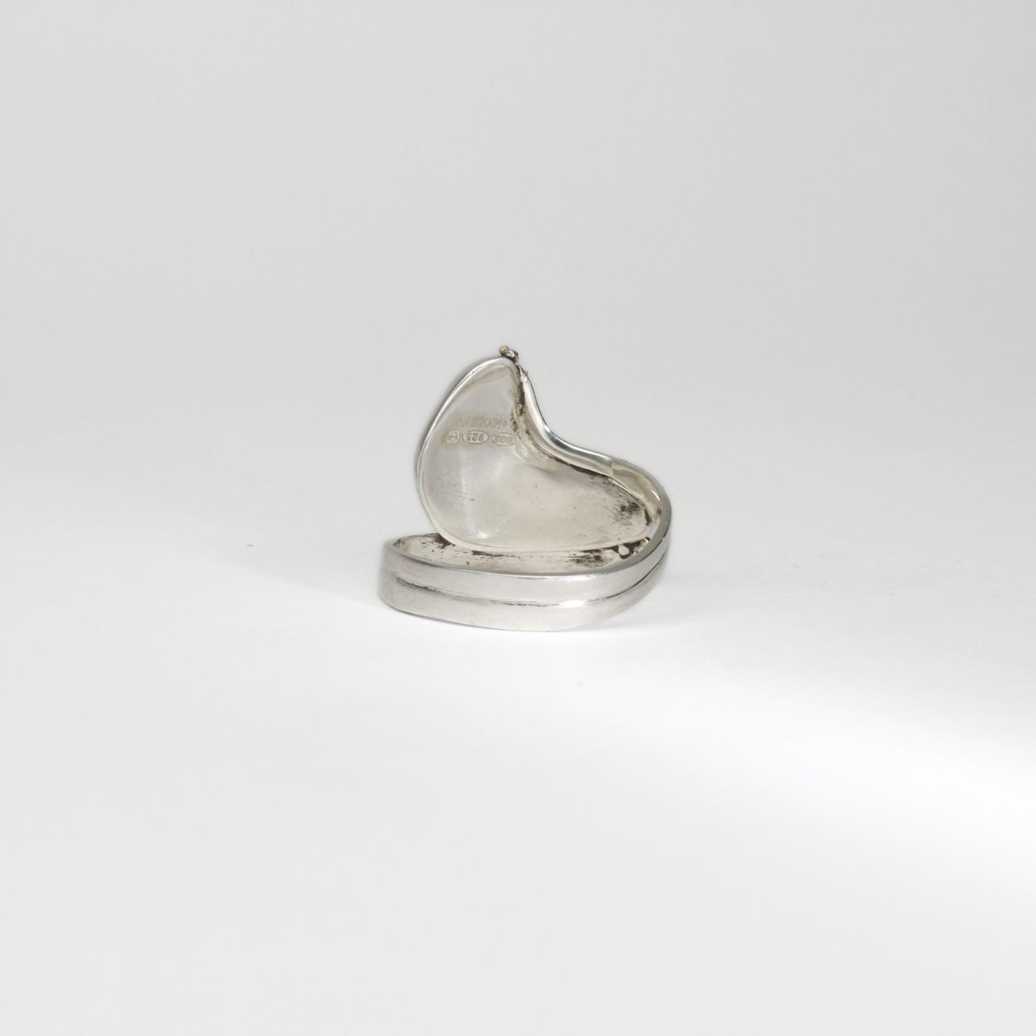 Niobium, silver & gold ring by Brian Eburah