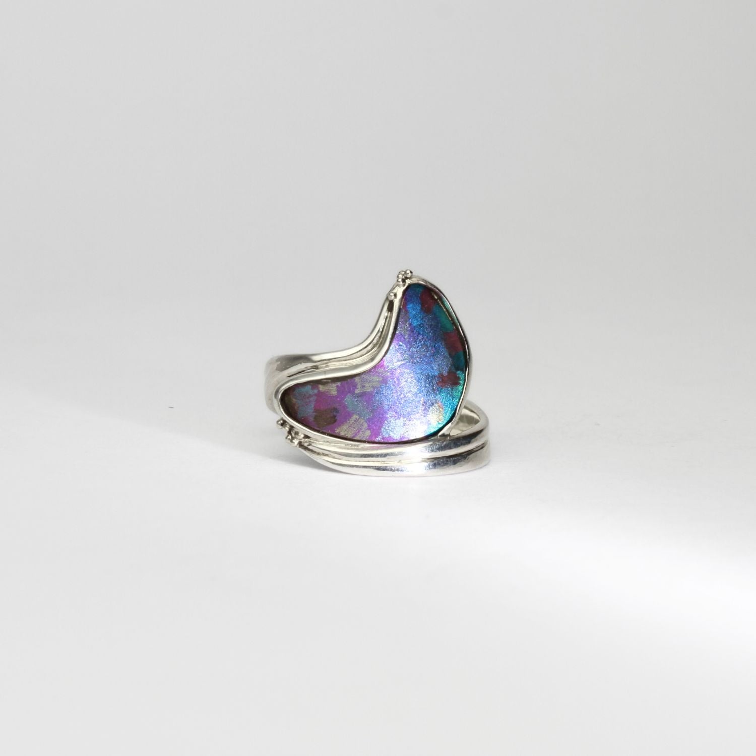 Niobium, silver & gold ring by Brian Eburah