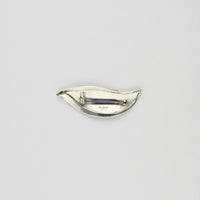 Brooch - niobium & silver by Brian Eburah
