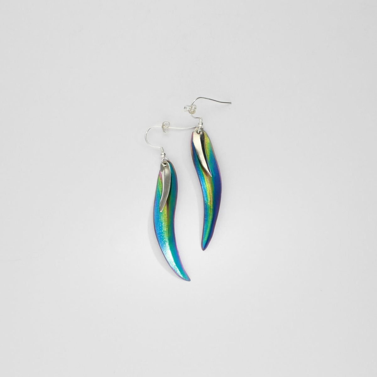 Earrings - poppy/daisy niobium & silver hook earrings by Brian Eburah