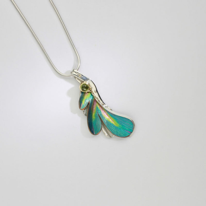 Pendant - poppy/daisy niobium, silver & 18ct gold pendant with peridot by Brian Eburah