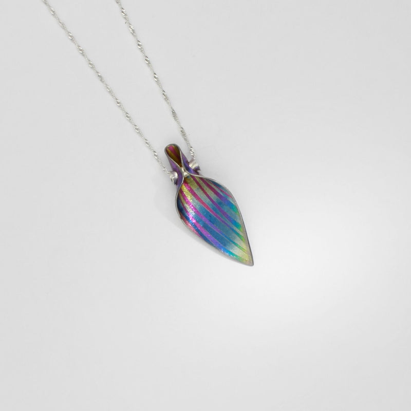 Pendant - niobium & silver pendant by Brian Eburah