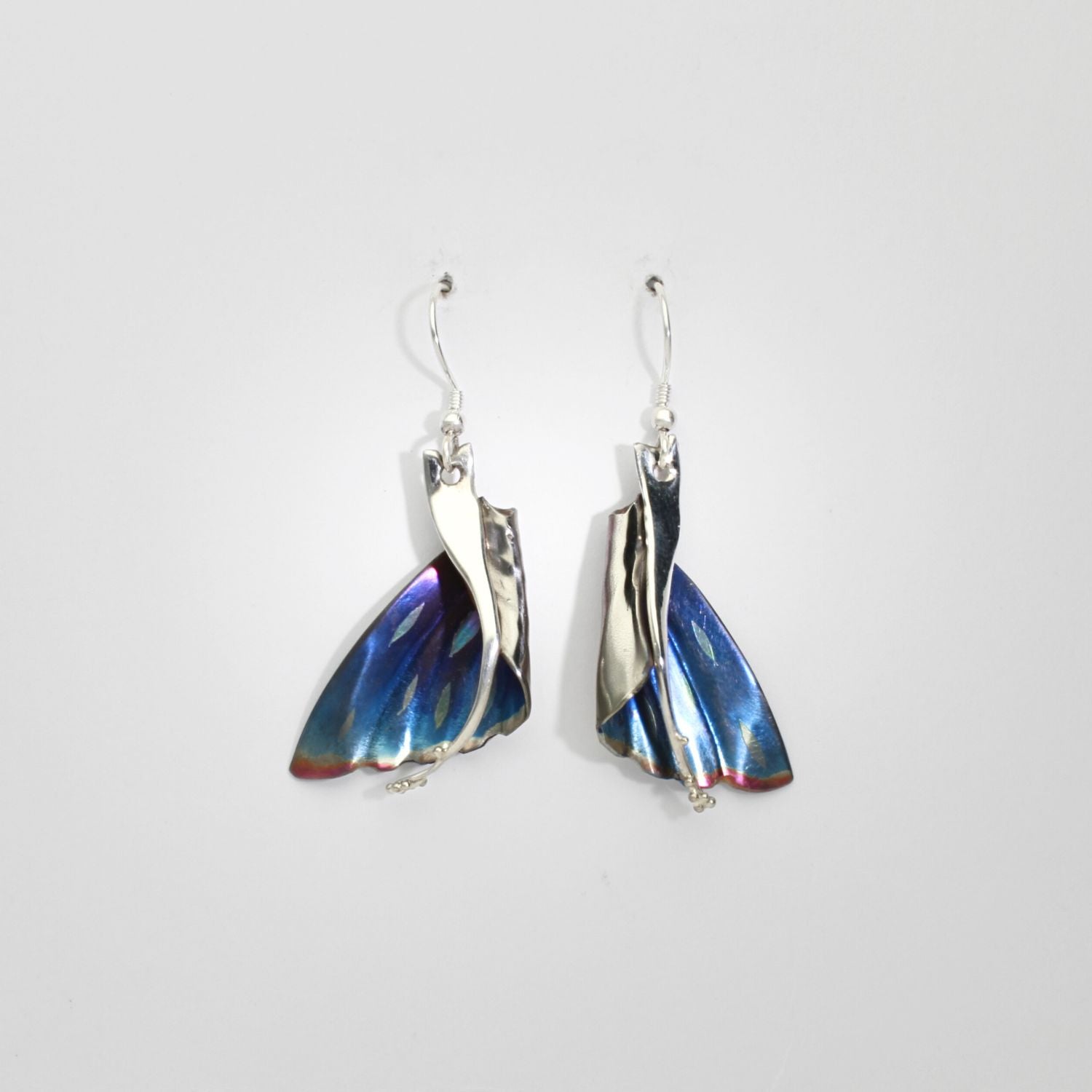 Niobium & silver drop earrings by Brian Eburah