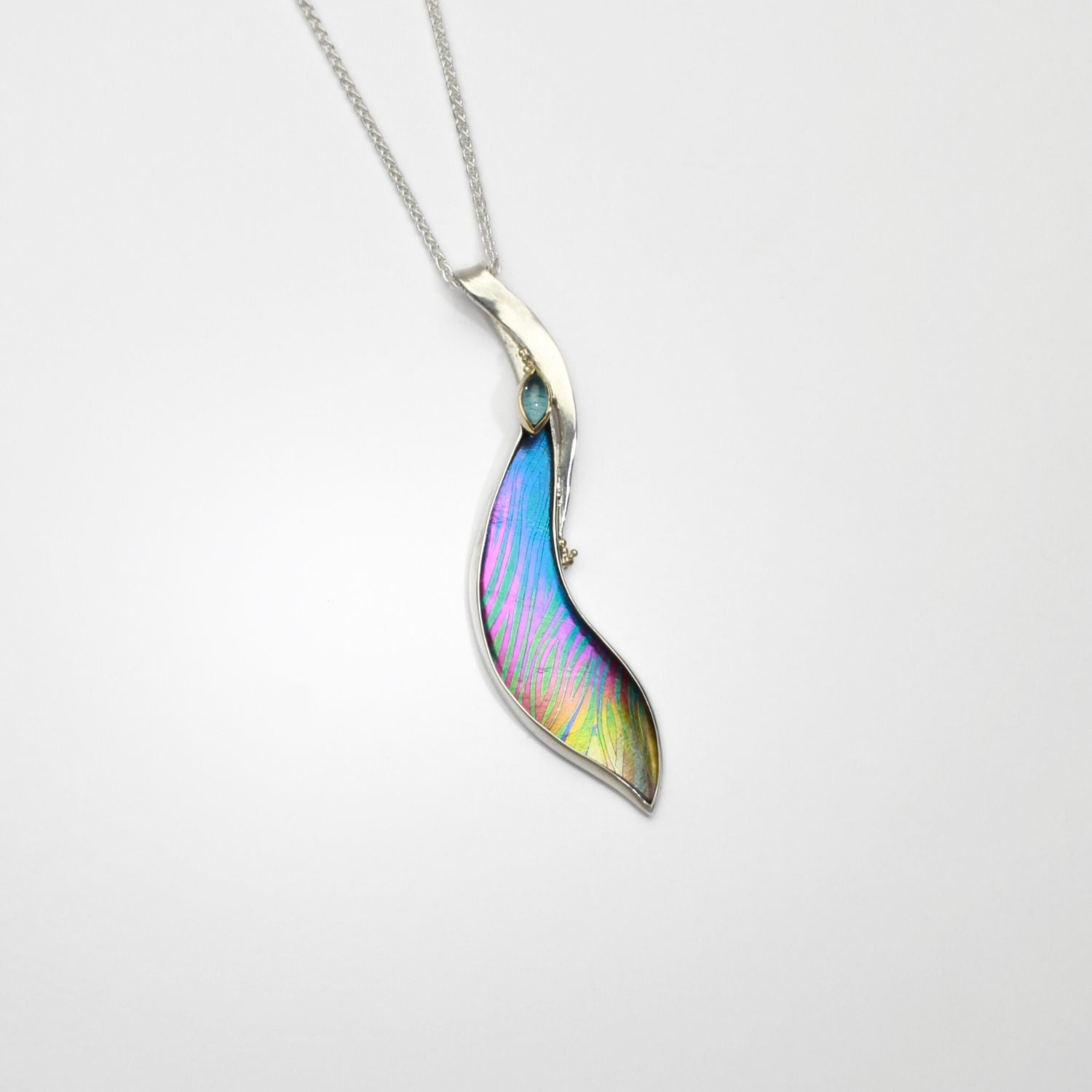 Pendant - Niobium, silver & gold, pendant with blue topaz by Brian Eburah