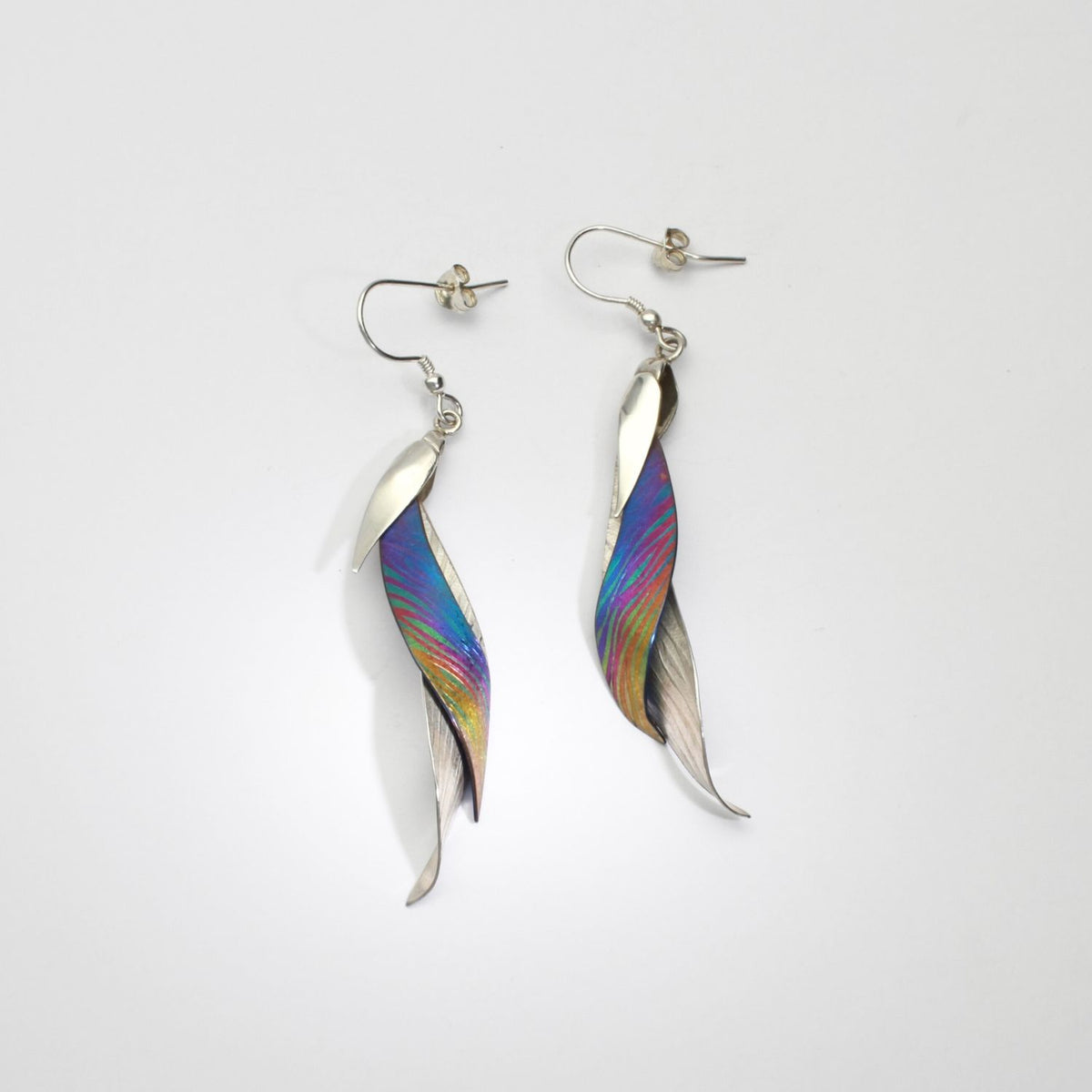 Niobium & silver drop earrings by Brian Eburah