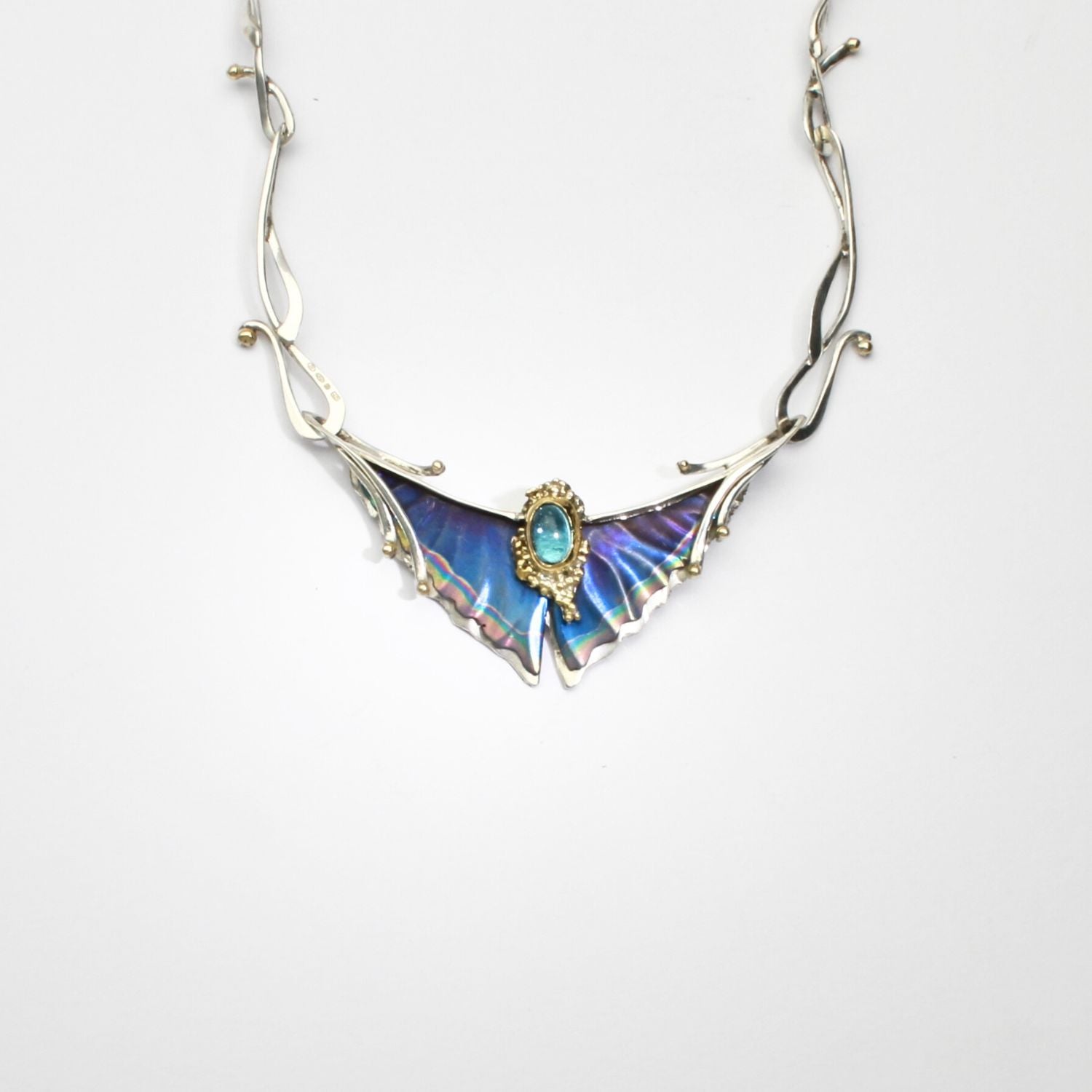 Niobium, silver, gold & blue topaz necklace by Brian Eburah