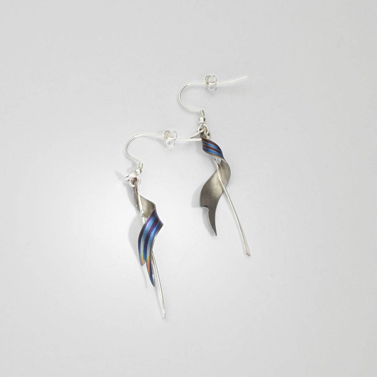Niobium & silver drop earrings by Brian Eburah