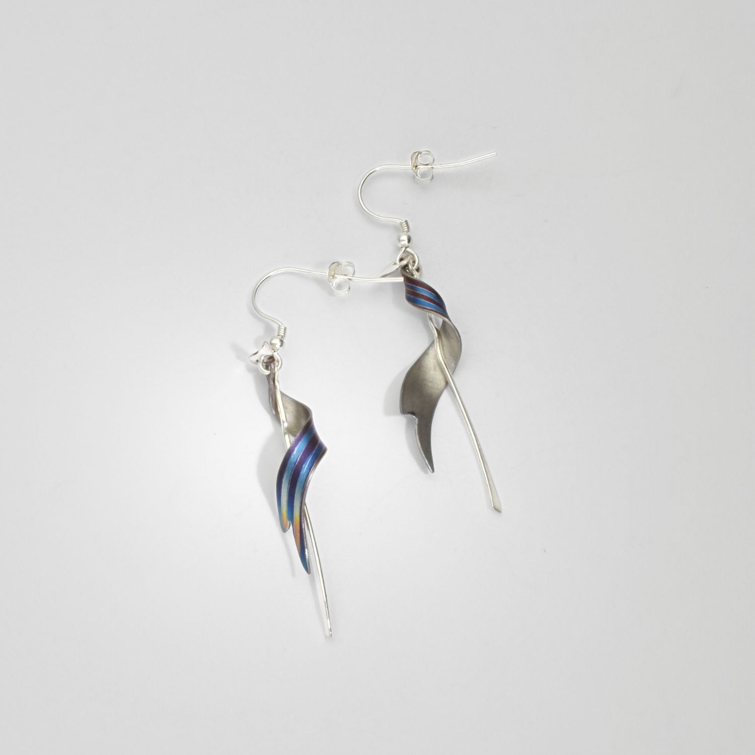 Niobium & silver drop earrings by Brian Eburah