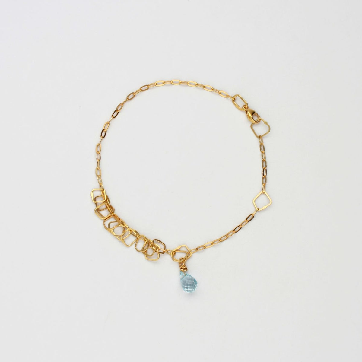Delicate silver 24kt gold plated bracelet with blue topaz brio gemstone by Bea Jareno