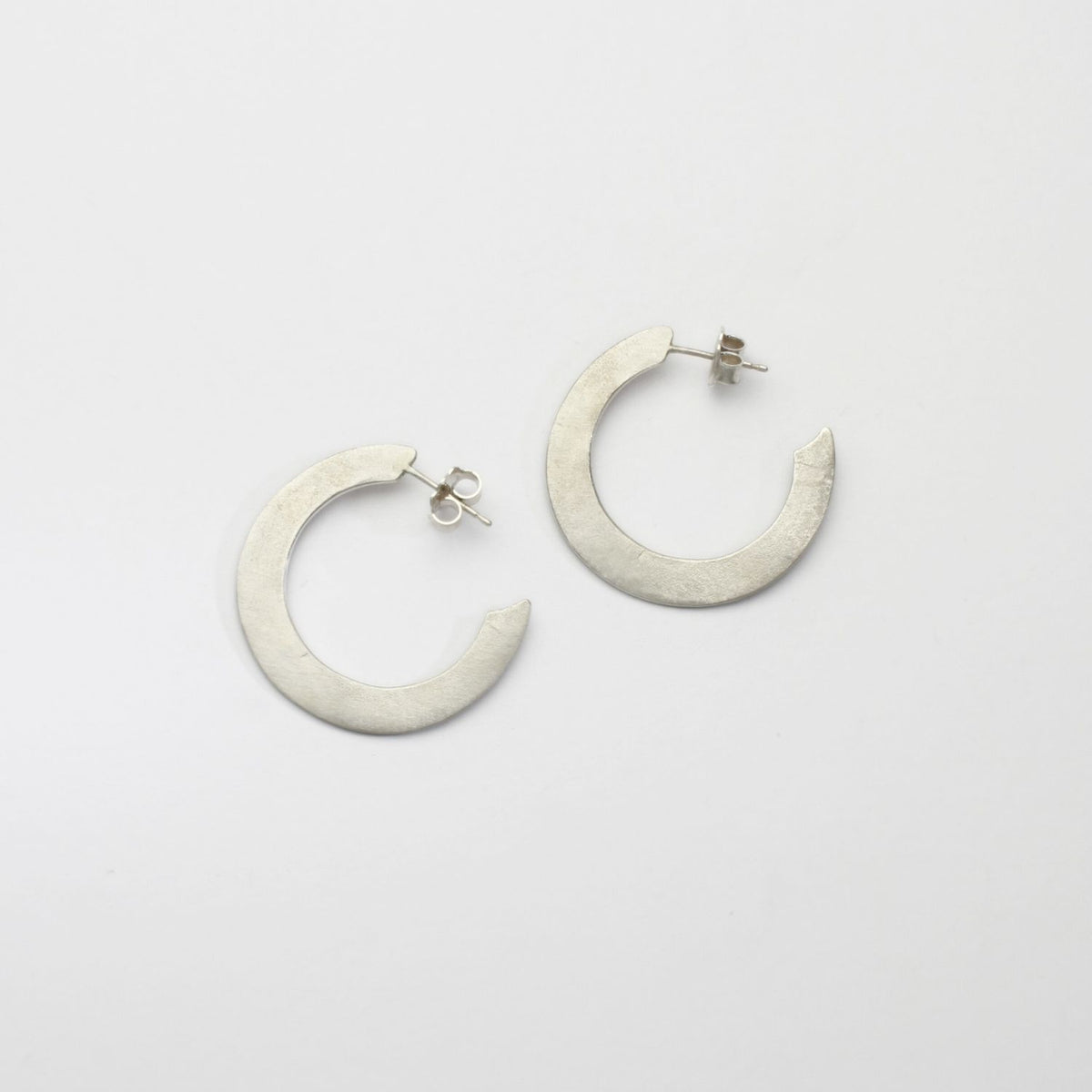 Large silver hoops by Bea Jareno