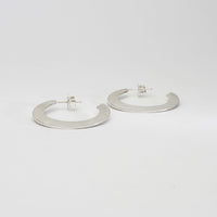 Large silver hoops by Bea Jareno