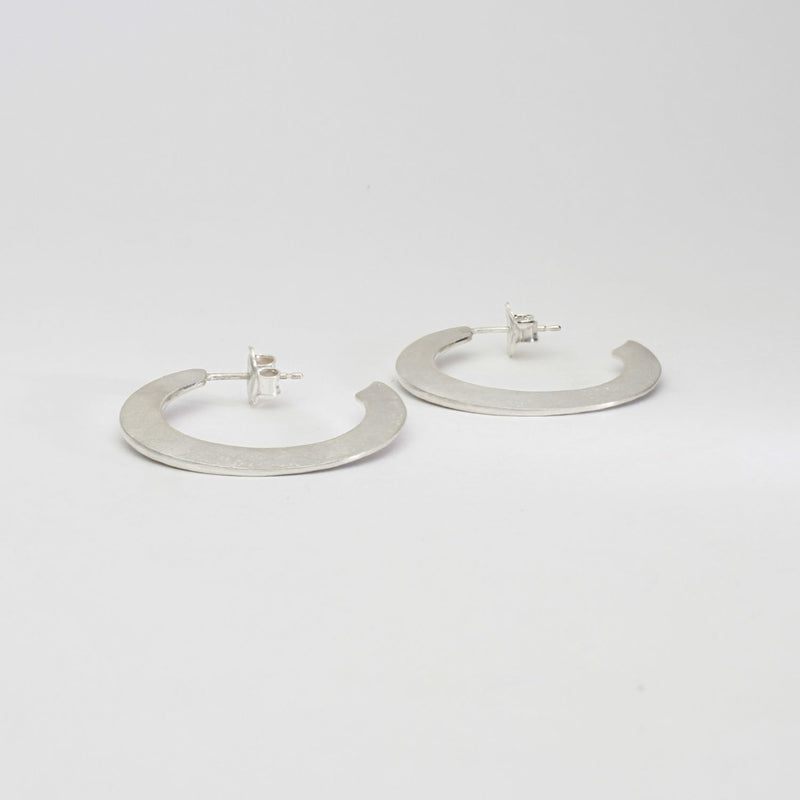 Large silver hoops by Bea Jareno