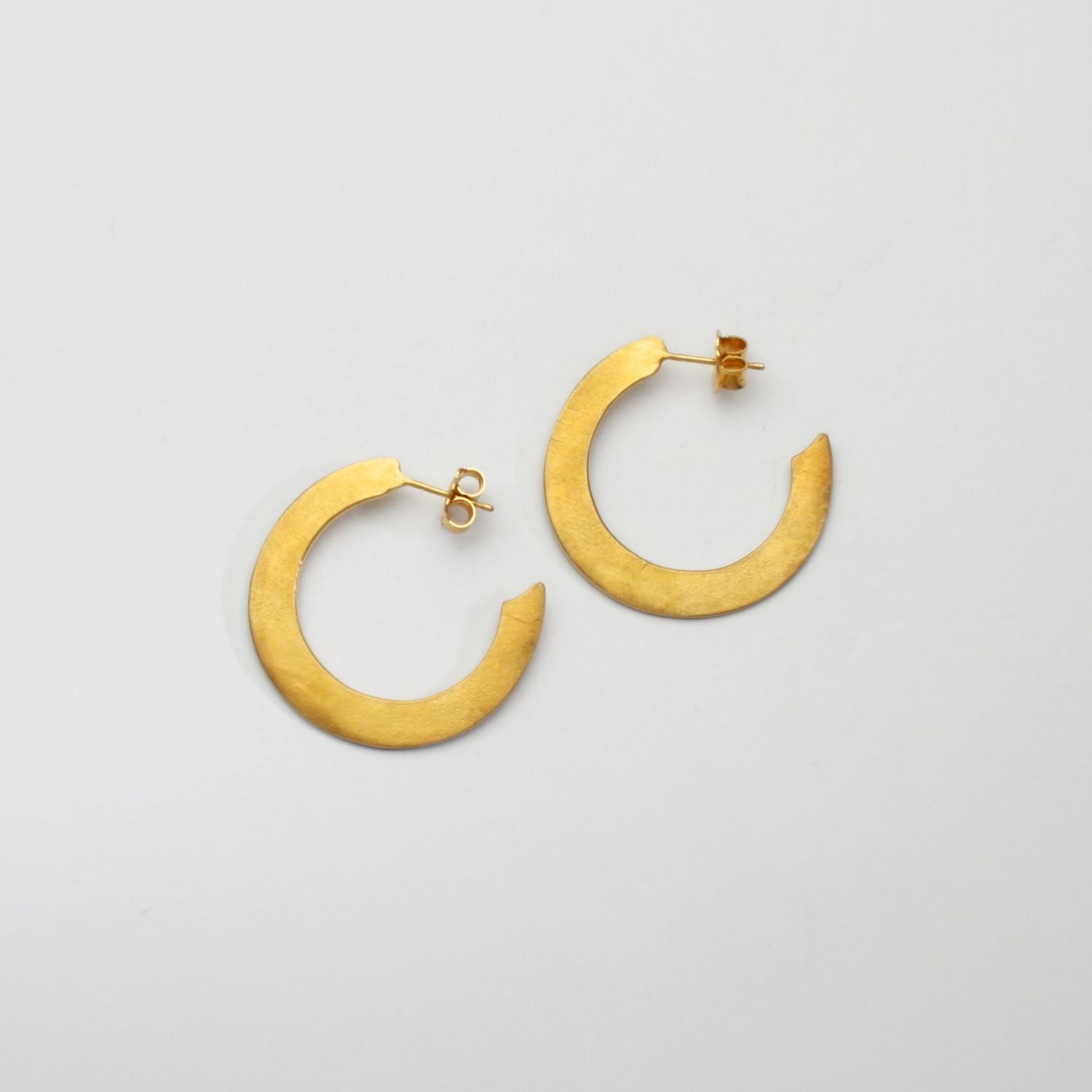 Large silver 24kt gold plated hoops by Bea Jareno