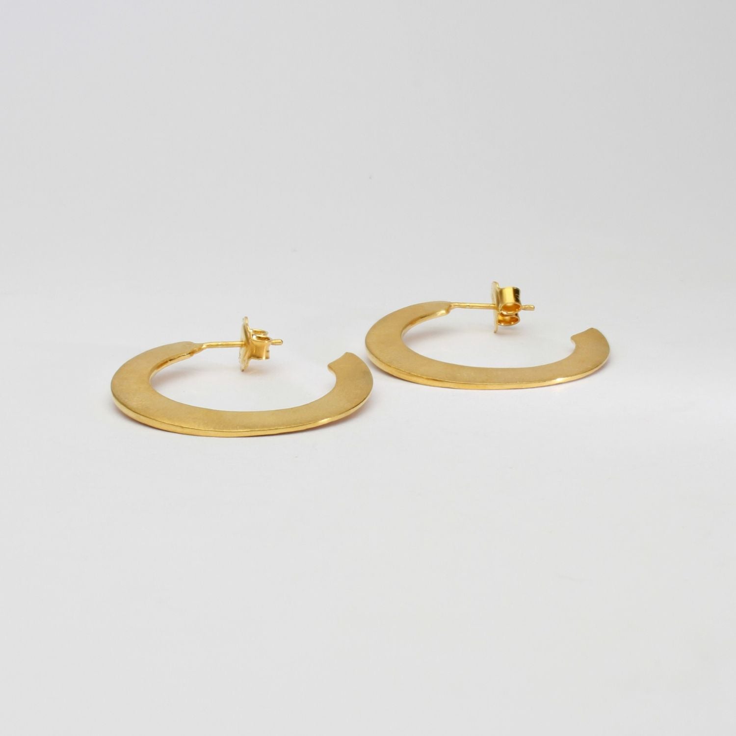 Large silver 24kt gold plated hoops by Bea Jareno