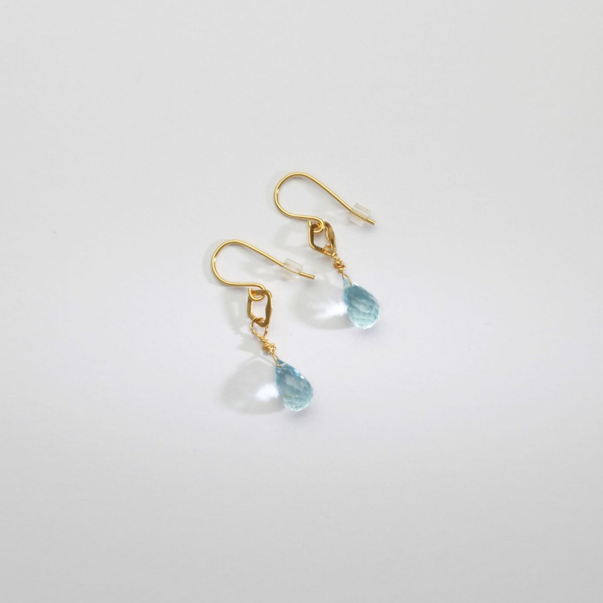 Tiny hook earrings with blue topaz silver gold plated by Bea Jareno