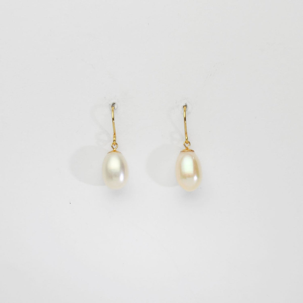 White freshwater pearls silver 24kt gold plated hook earrings by Bea Jareno