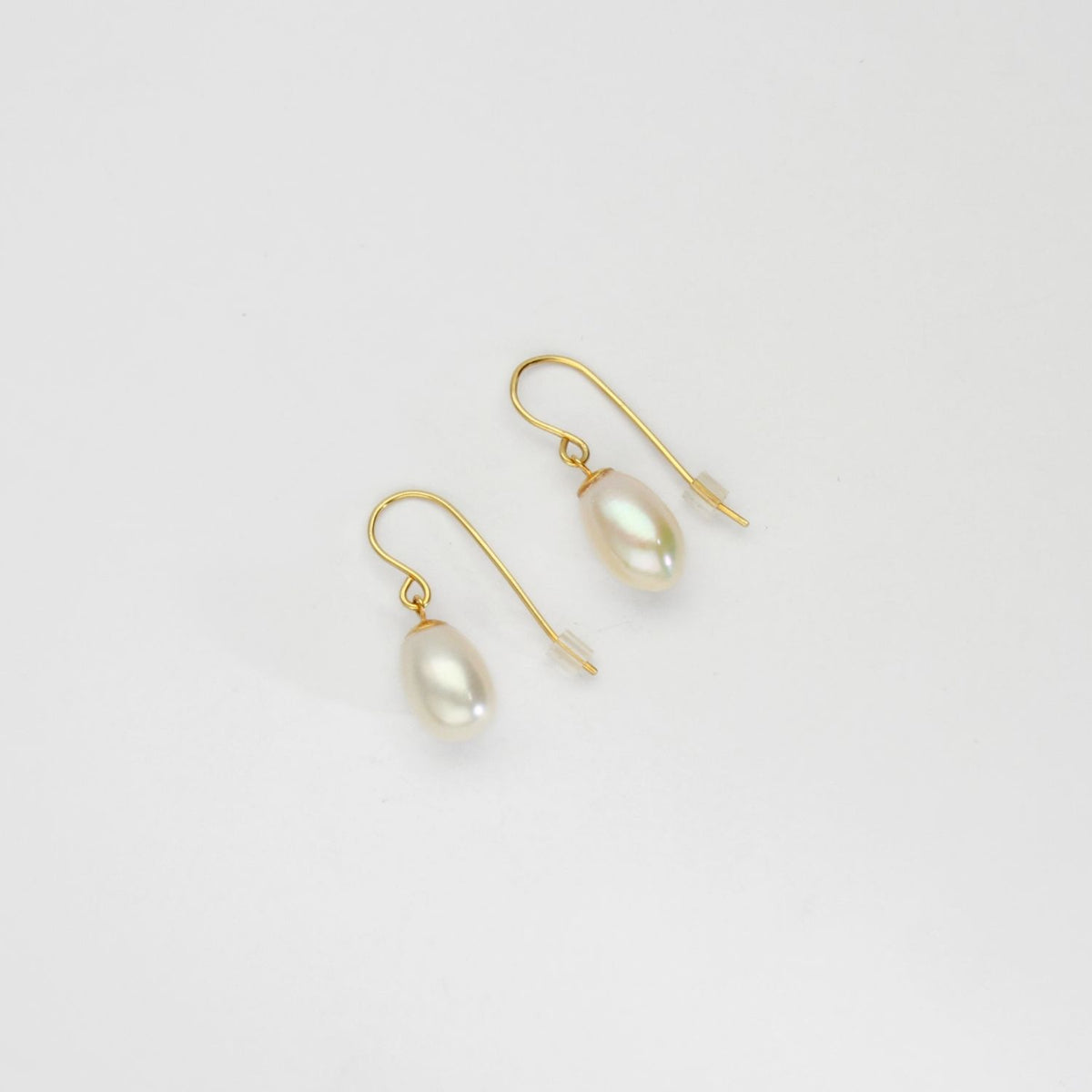 White freshwater pearls silver 24kt gold plated hook earrings by Bea Jareno
