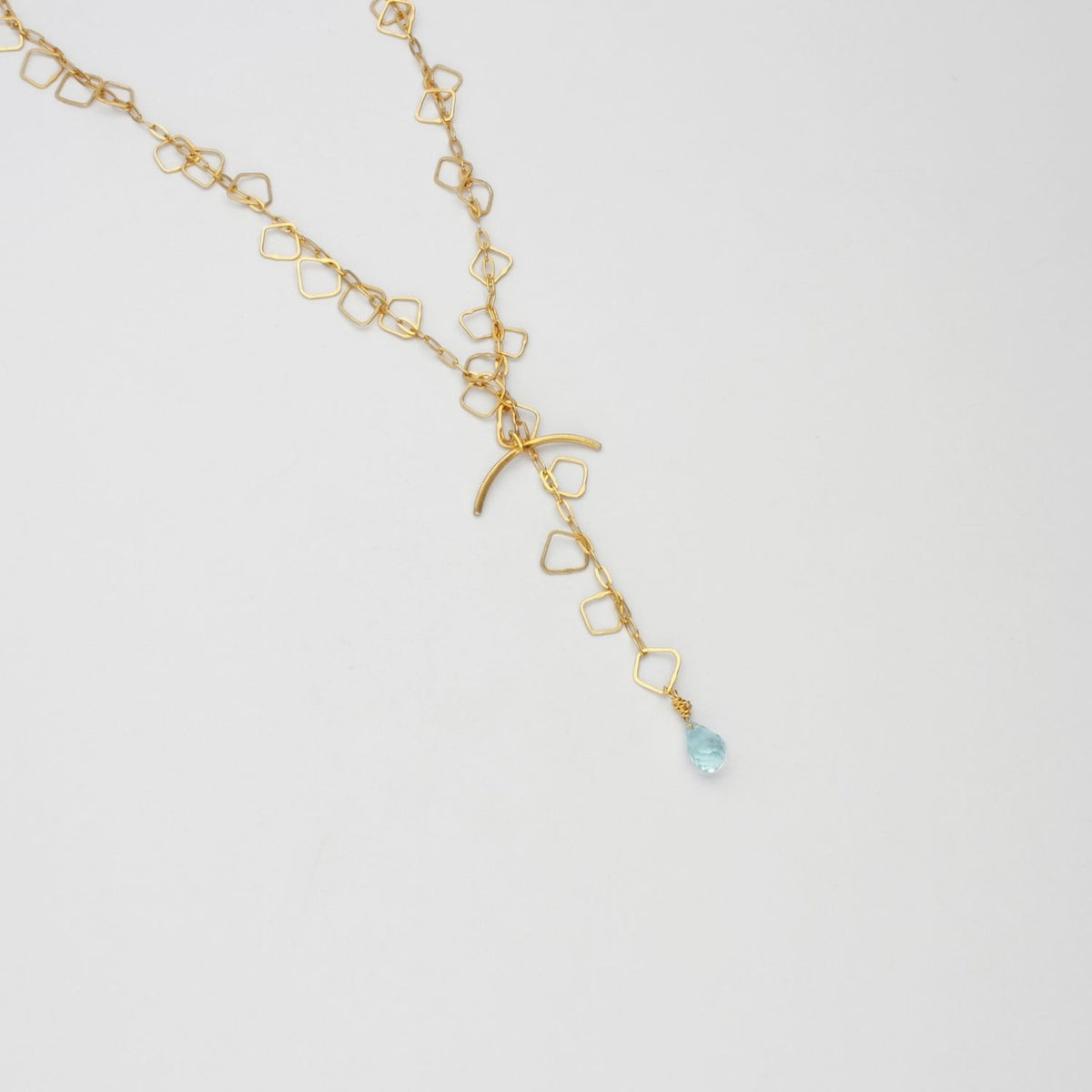 Kinetic fine irregular links gold plated necklace with blue topaz brio gemstone by Bea Jareno
