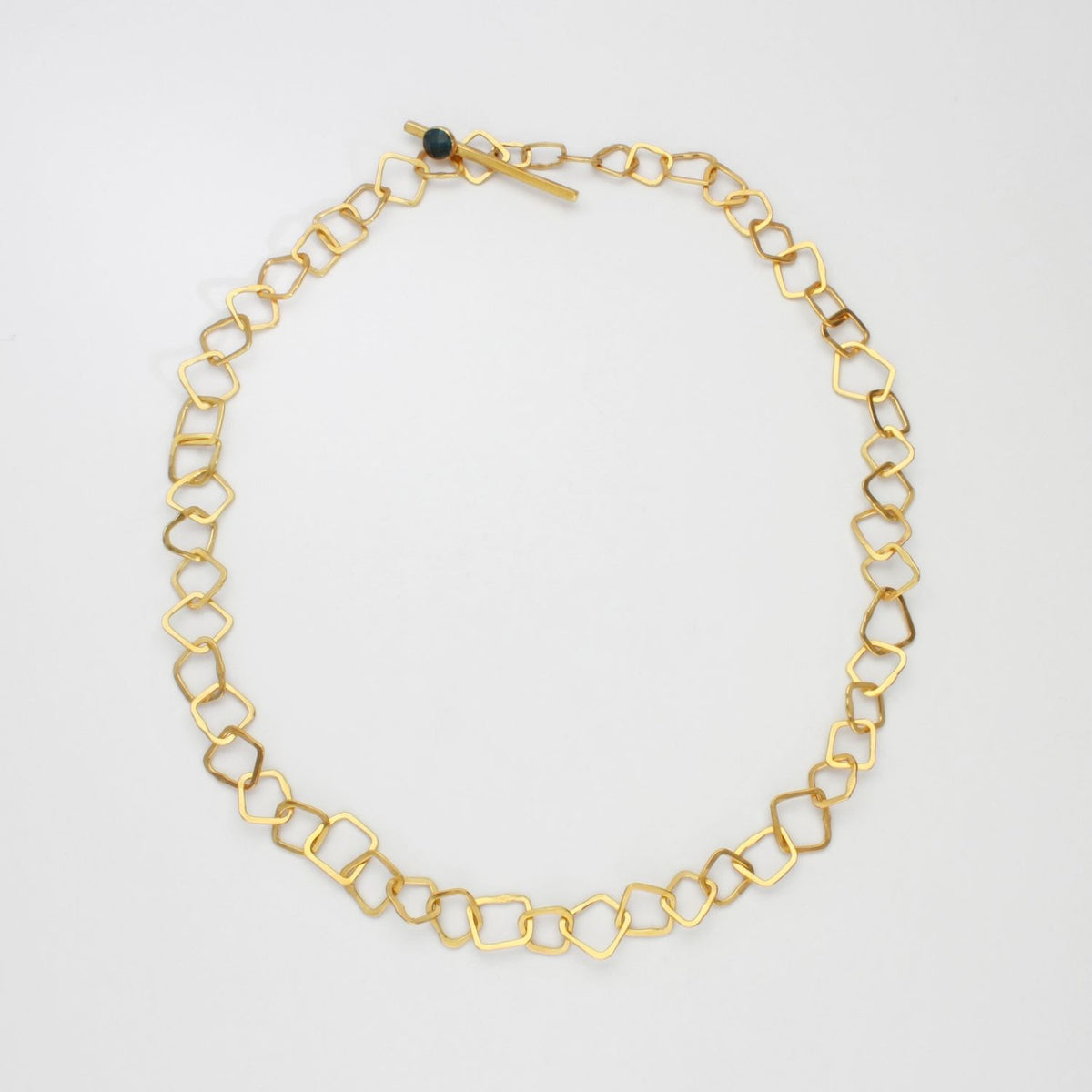Chunky links necklace 24kt gold plated with rose cut blue topaz on clasp by Bea Jareno