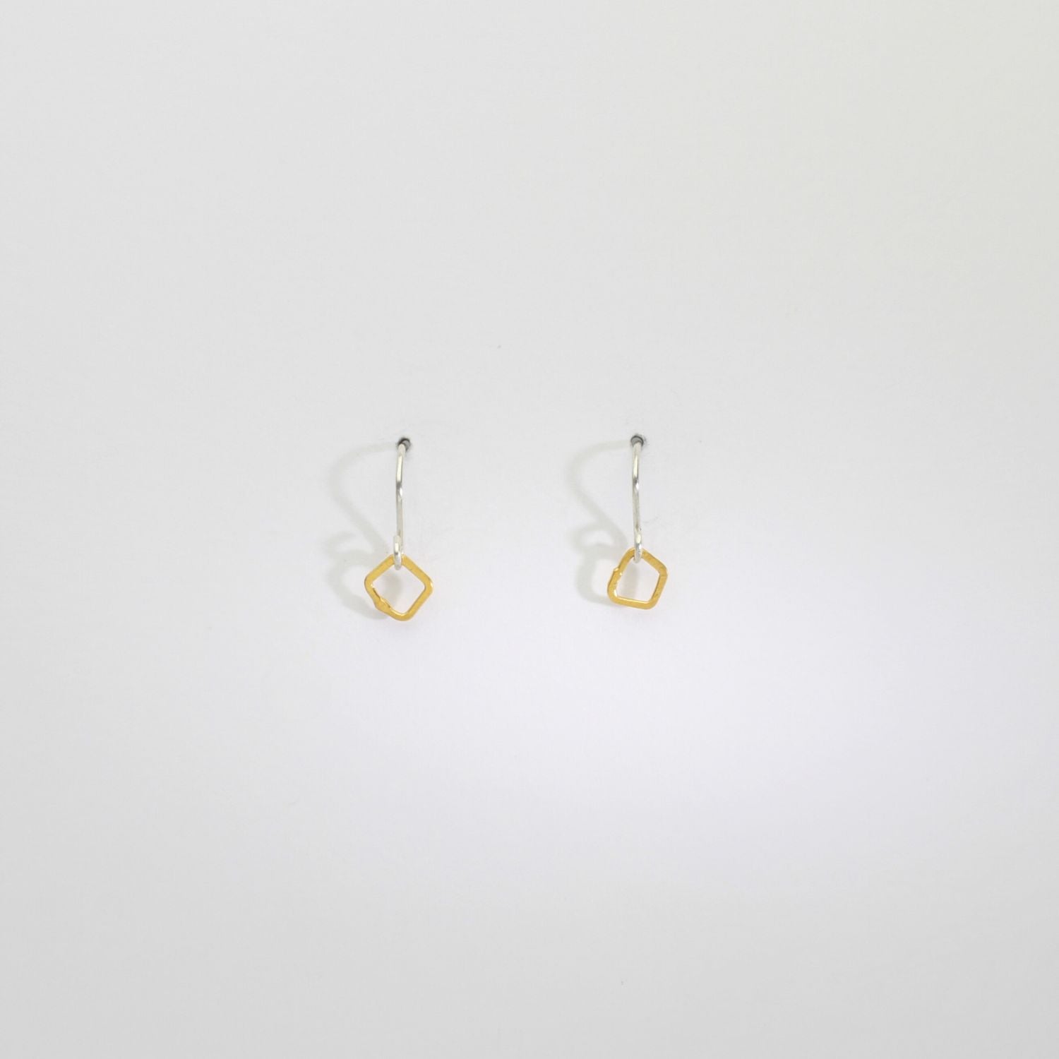 Tiny silver & gold plated hook earrings by Bea Jareno