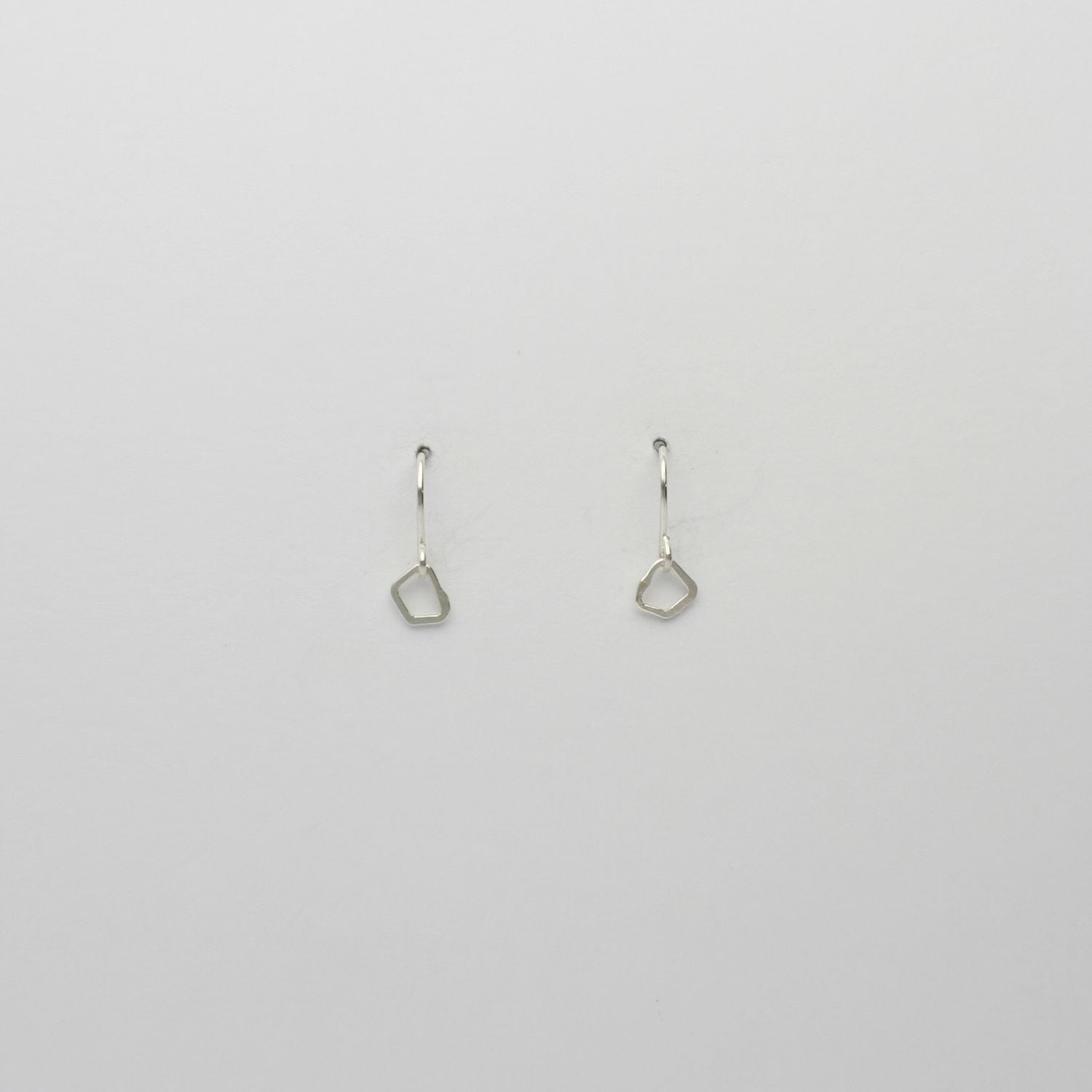 Tiny silver hook earrings by Bea Jareno
