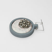 Brooch - Beading on cotton with stem stitch & seeding by Beatrice Mayfield