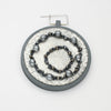 Brooch - Beading on cotton with seeding by Beatrice Mayfield