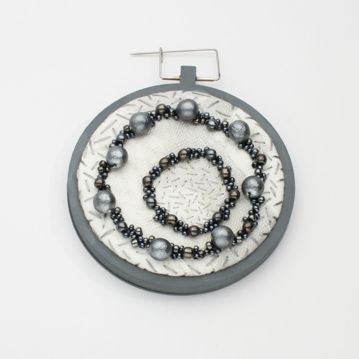Brooch - Beading on cotton with seeding by Beatrice Mayfield