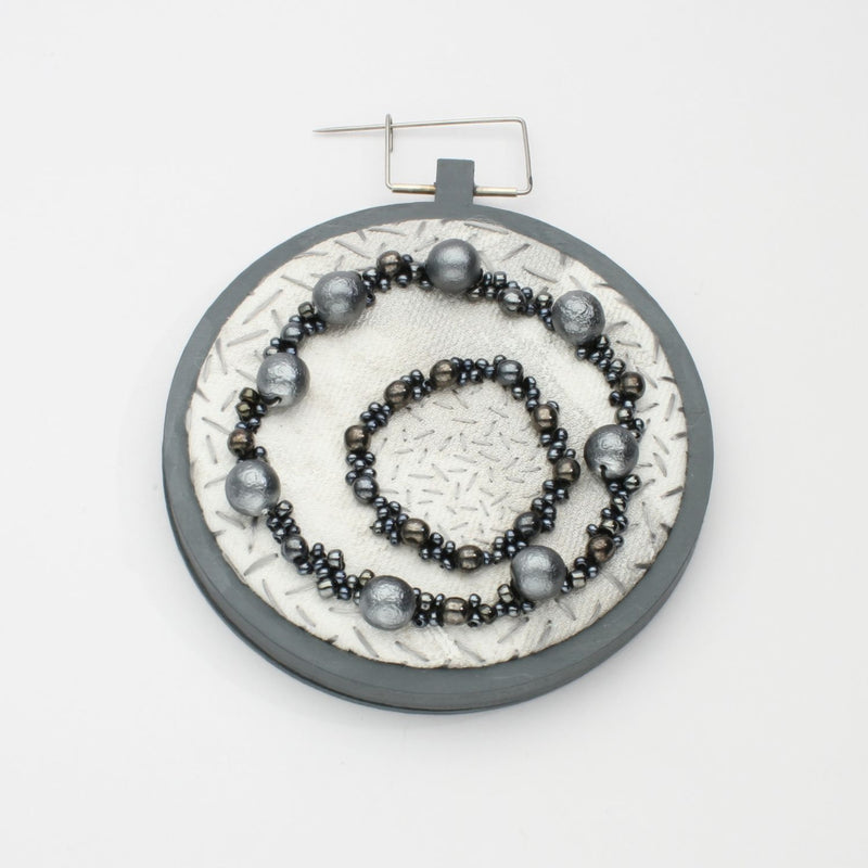 Brooch - Beading on cotton with seeding by Beatrice Mayfield