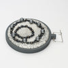 Brooch - Beading on cotton with seeding by Beatrice Mayfield