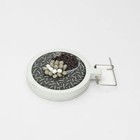 Brooch - Beading on cotton with French knots by Beatrice Mayfield