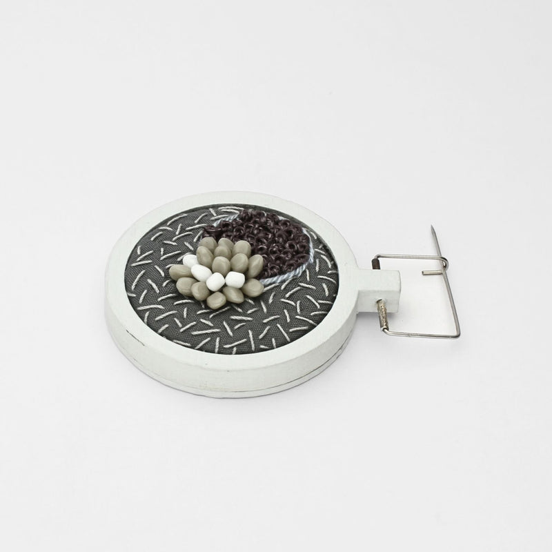 Brooch - Beading on cotton with French knots by Beatrice Mayfield