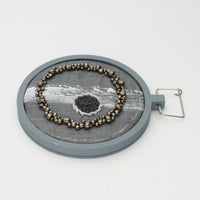 Brooch - Beading on cotton with stem stitch & French knots by Beatrice Mayfield