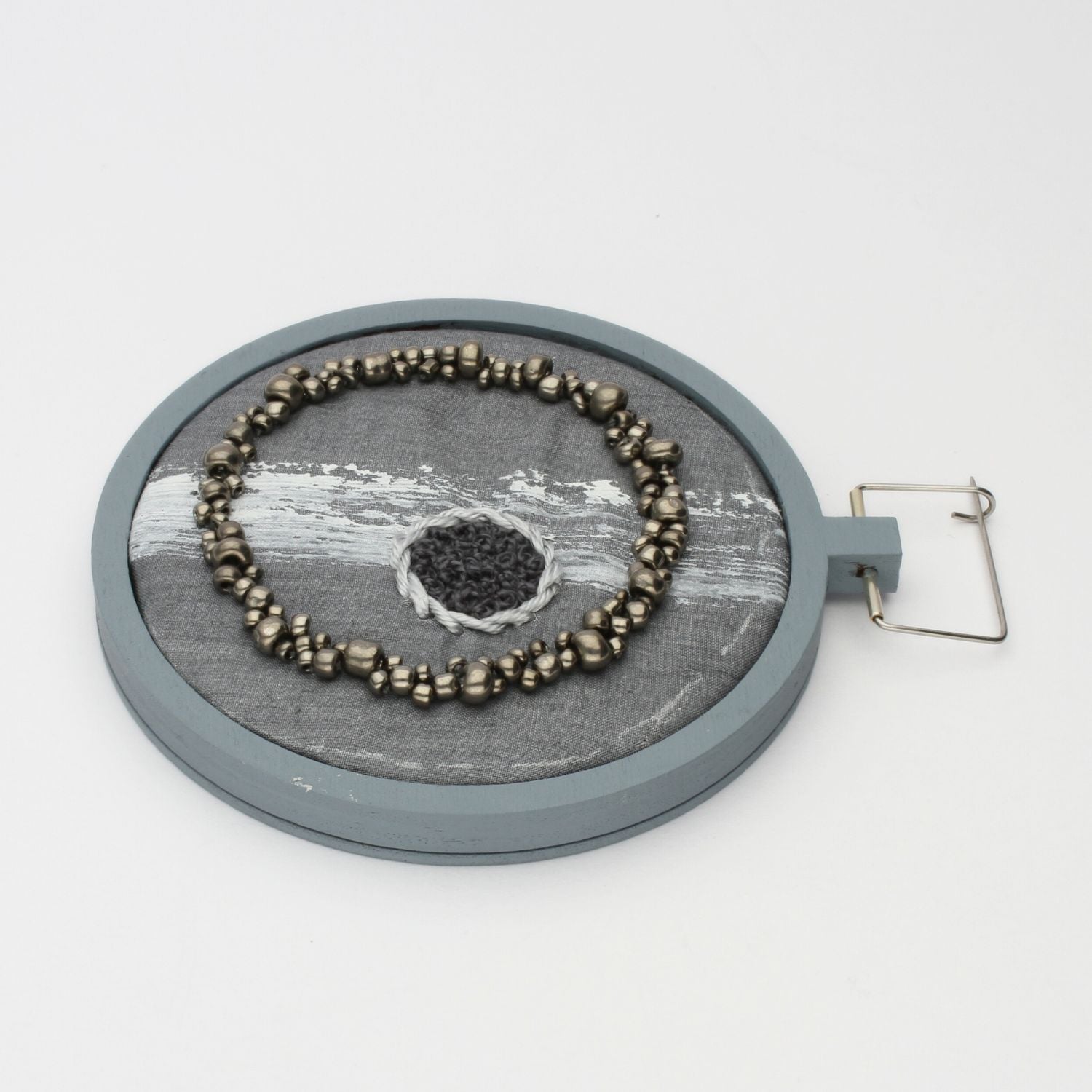 Brooch - Beading on cotton with stem stitch & French knots by Beatrice Mayfield