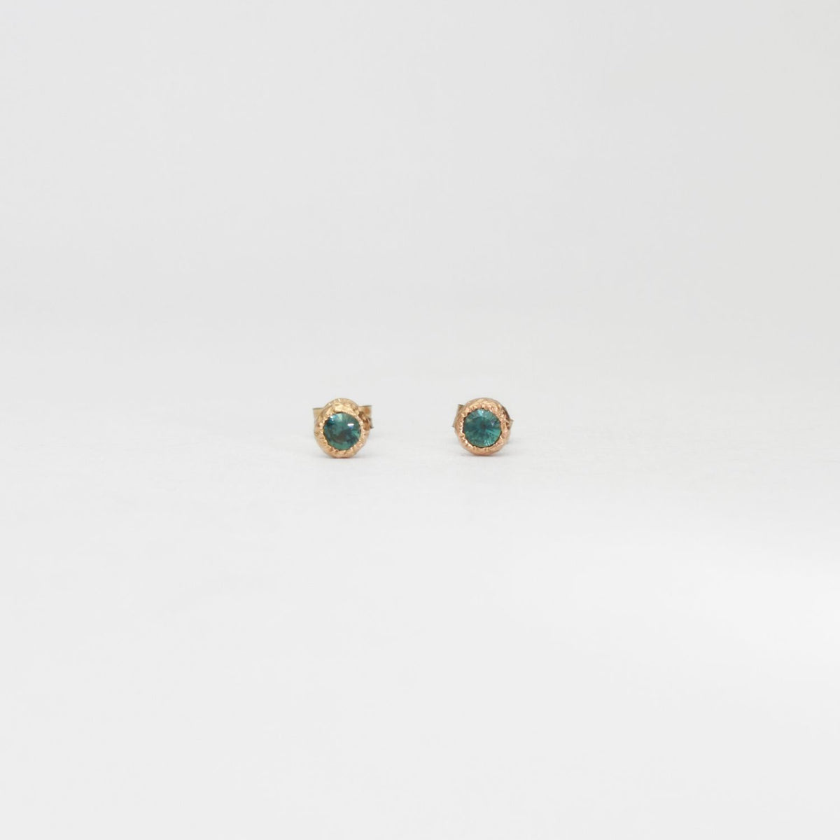9ct gold textured pebble studs with Australian parti sapphires by Blae Maddrell